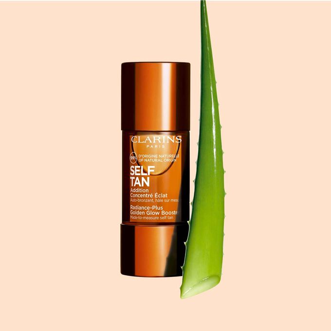 Packshot of Radiance-Plus Golden Glow Booster for Face by Clarins a concentrate to mix with face cream near aloe vera.