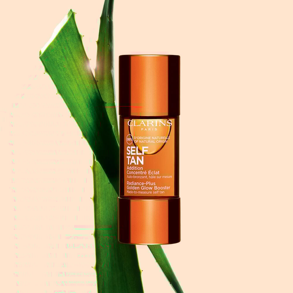 Packshot of Radiance-Plus Golden Glow Booster for Face by Clarins a concentrate to mix with face cream near aloe vera.