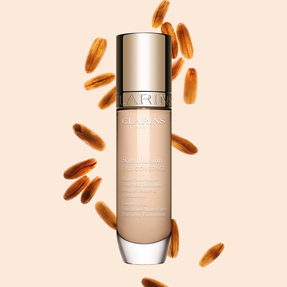 Clarins Skin Illusion Full Coverage showcasing its sleek design and vibrant packaging, the ideal foundation for a flawless & natural complexion.