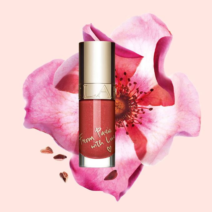 Clarins Lip Comfort Oil - Limited Edition in Nude shimmery shade, hydrating and plumping for all-day nourishment.