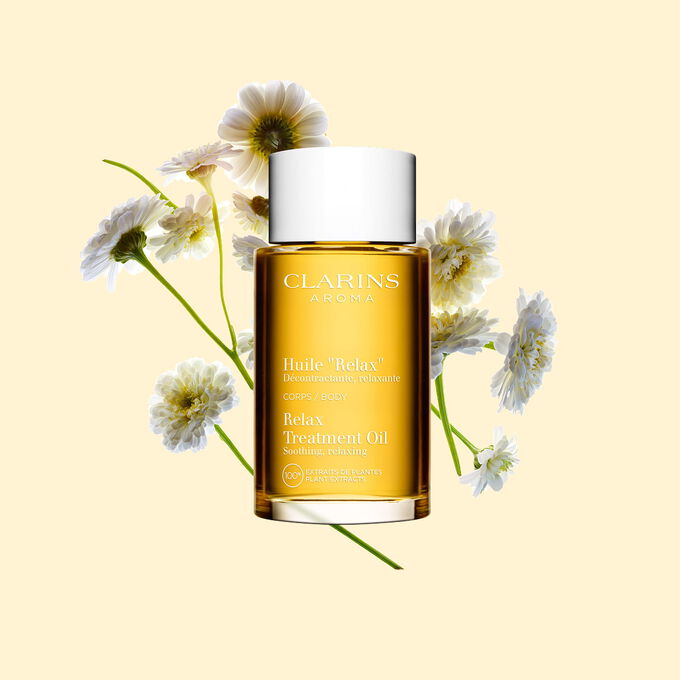 Clarins Relax Body Treatment Oil with 100% pure plant extracts for stress relief and promoting a feeling of well-being.