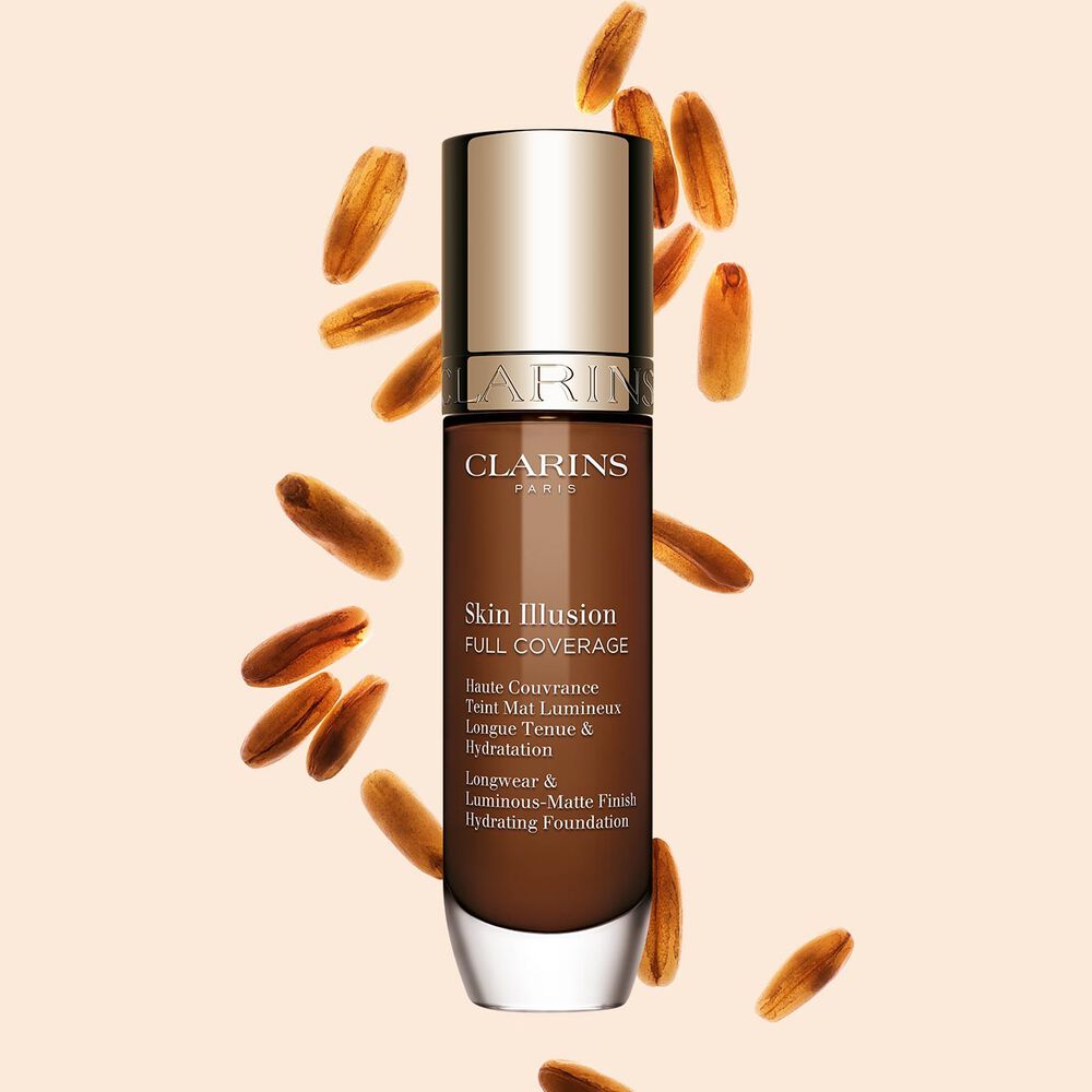 Clarins Skin Illusion Full Coverage showcasing its sleek design and vibrant packaging, the ideal foundation for a flawless & natural complexion.