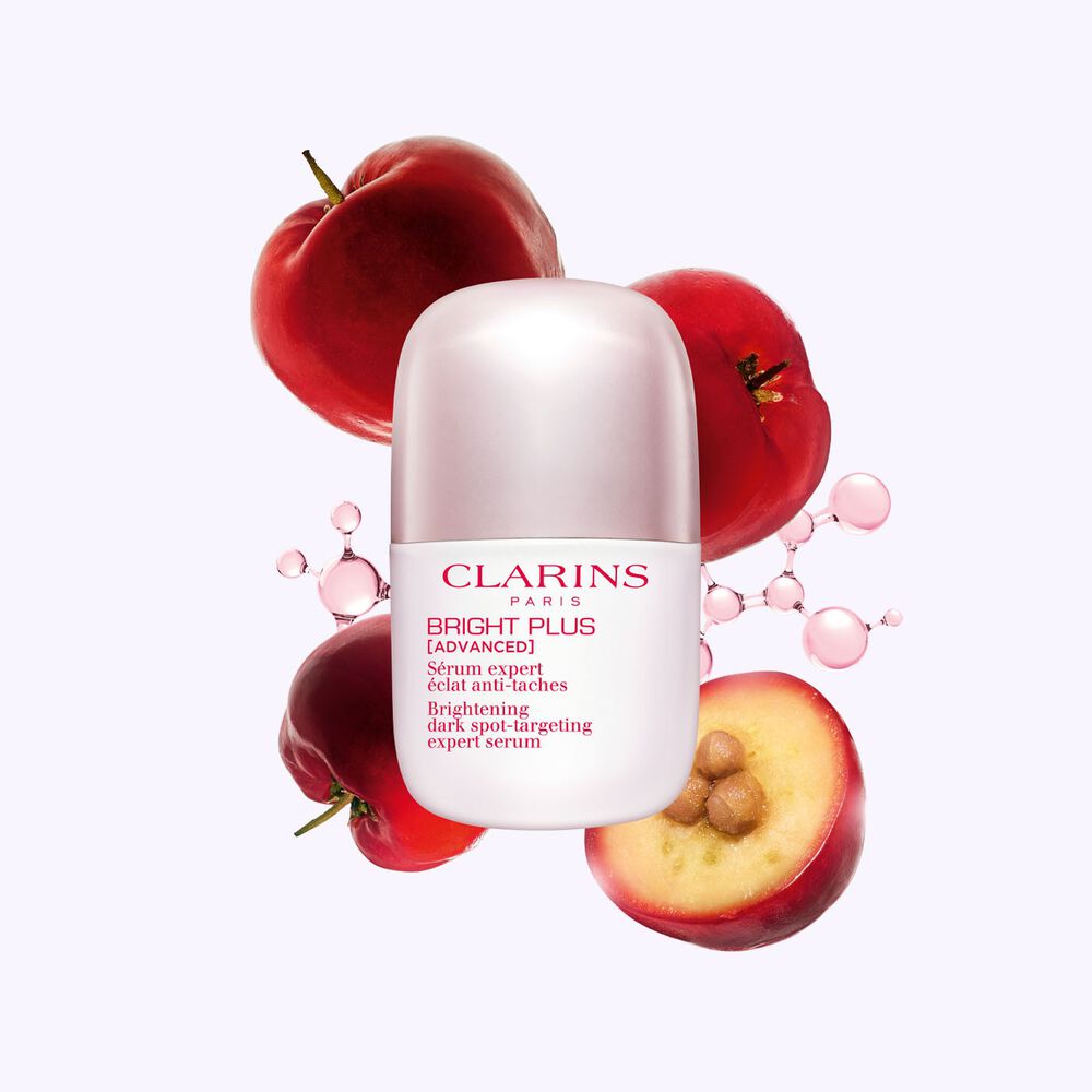 Packshot of Clarinsn anti-blemish niacinamide serum placed next to acerola fruits and a niacinamide molecule