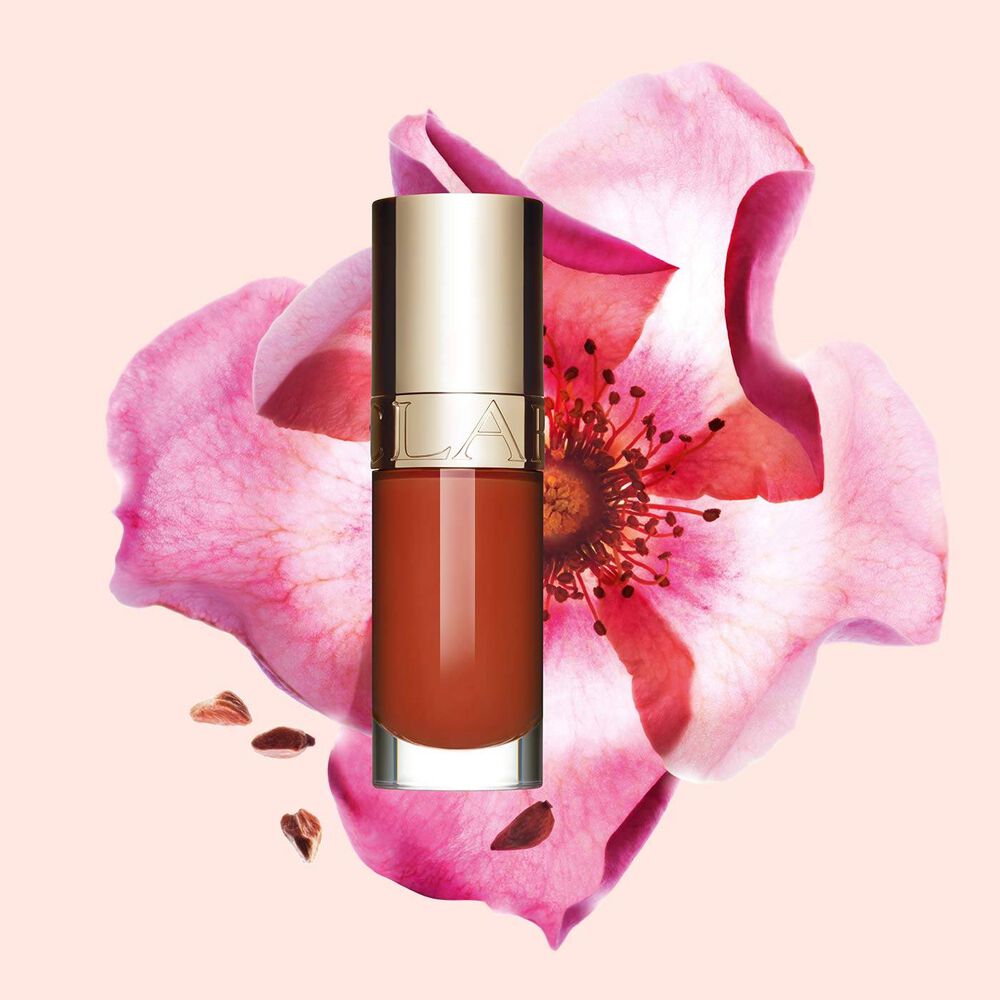 Clarins Lip Comfort Oil - Limited Edition in Bright brick shade, hydrating and plumping for all-day nourishment.