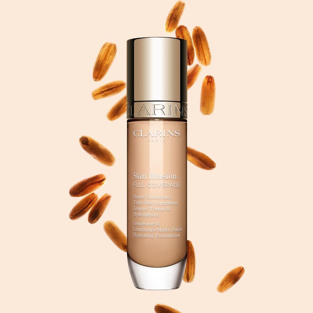 Clarins Skin Illusion Full Coverage showcasing its sleek design and vibrant packaging, the ideal foundation for a flawless & natural complexion.