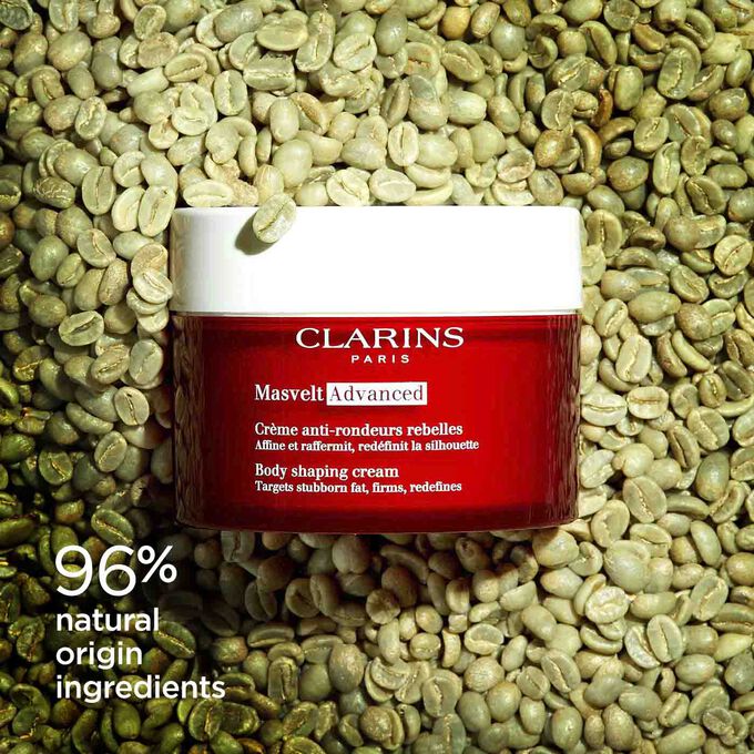 Clarins Masvelt Advanced Body Shaping Cream among coffee beans to illustrate the natural origin of the product's ingredients