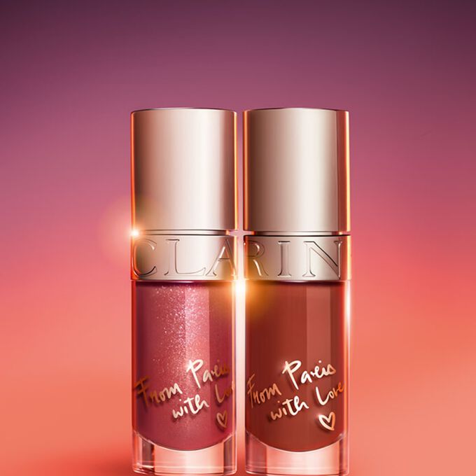 Clarins Lip Comfort Oil - Limited Edition in Nude shimmery shade, showcasing a glossy, plumped look. From Paris with love.