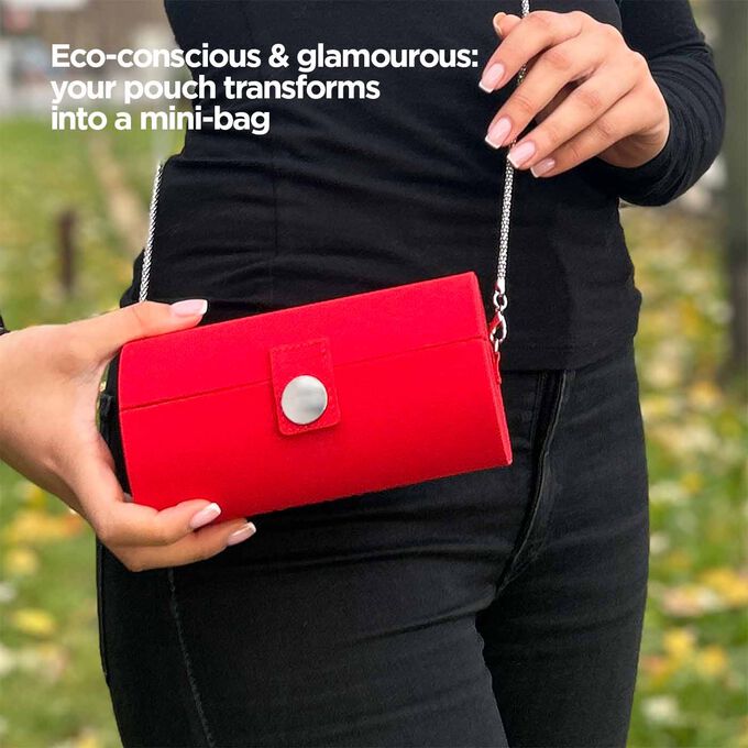 Close-up of the pouch, showcasing its red design and its ability to transform into a mini-bag with a strap.