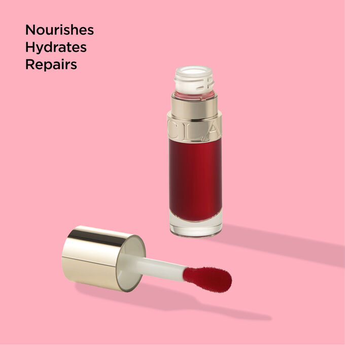 Packshot of Clarins Lip Comfort Oil 03 Cherry, emphasising its nourishing, hydrating, and repairing properties.